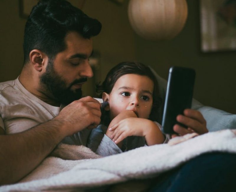 primary care dad checking ear